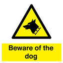 beware-of-the-dog-with-dog-warning-symbol~